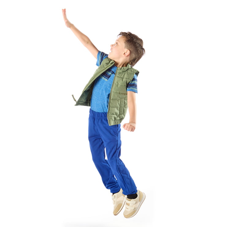 Thin Little Boy jumping in slim-fit royal blue joggers / Pants for Peants